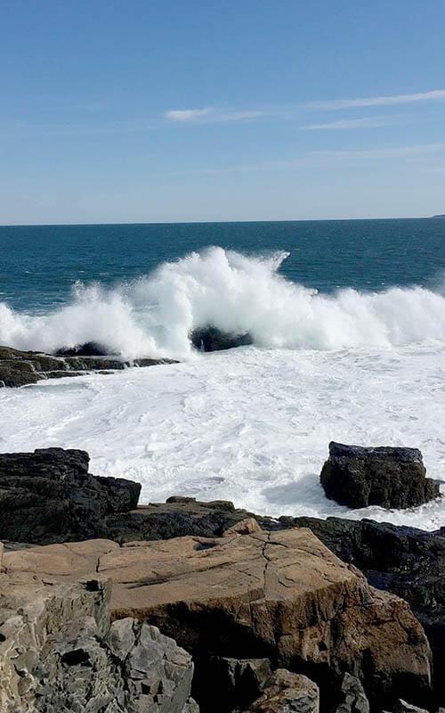 Waves crashing on the beach of Acadia